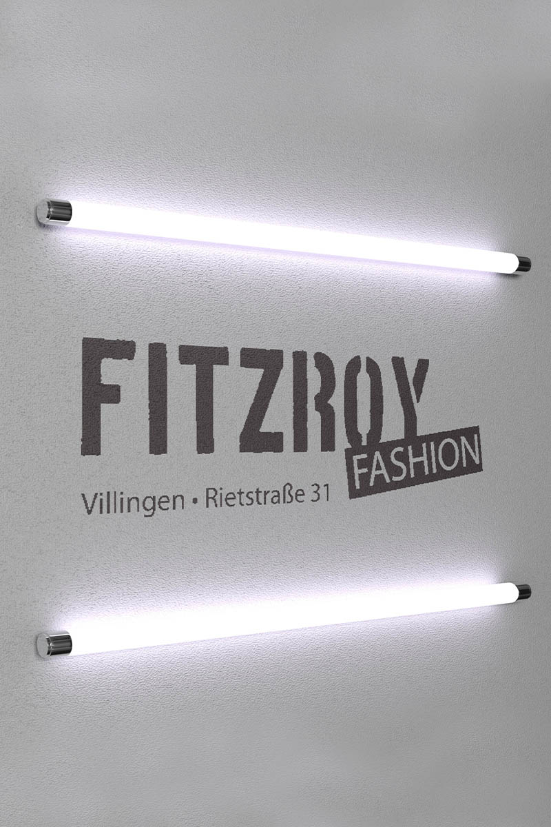 Lichtwerbung von Fitzroy an einer Fassade mit Leuchtröhren.